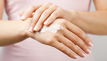 putting on hand cream